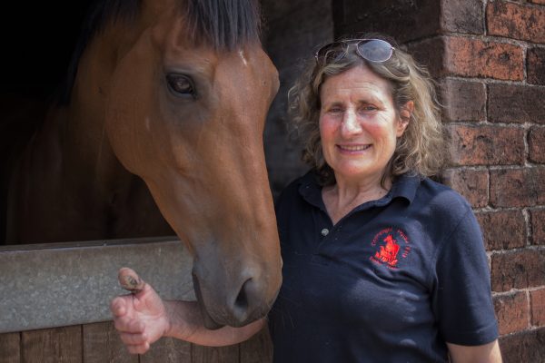 Image shows Sue Taylor with a horse